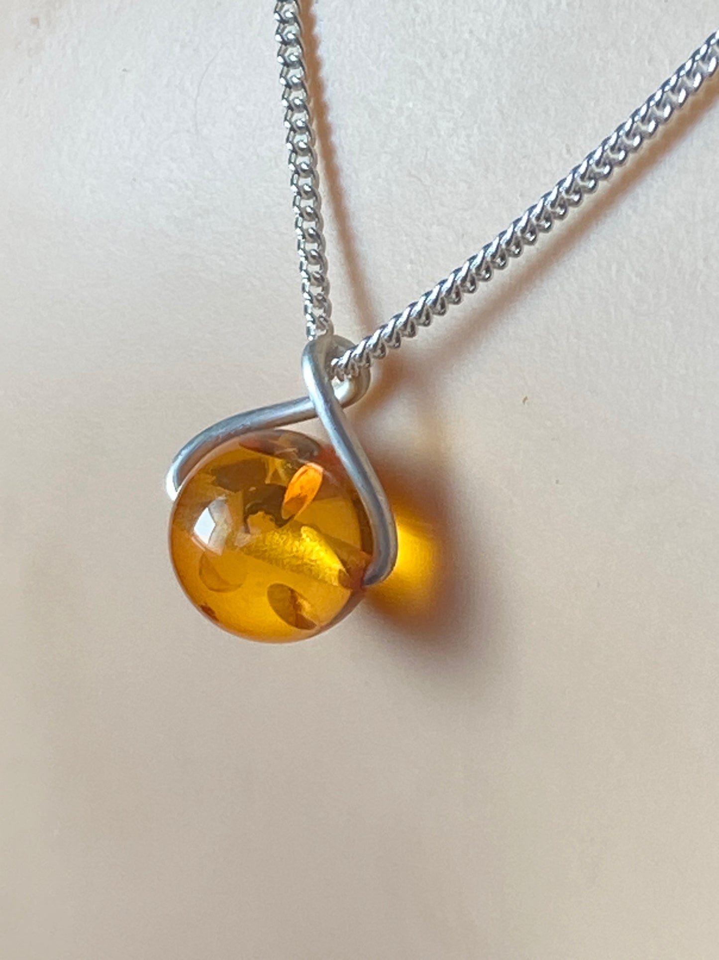 amber pendant, 18” sterling silver chain
