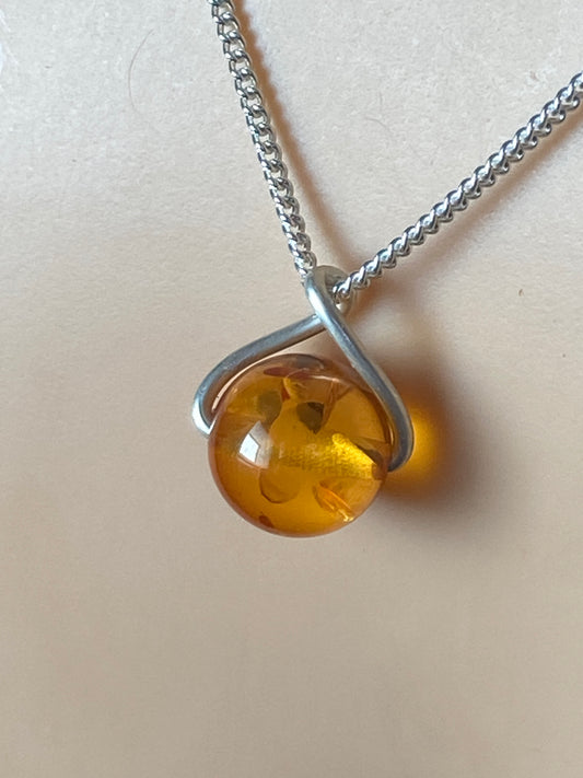 amber pendant, 18” sterling silver chain