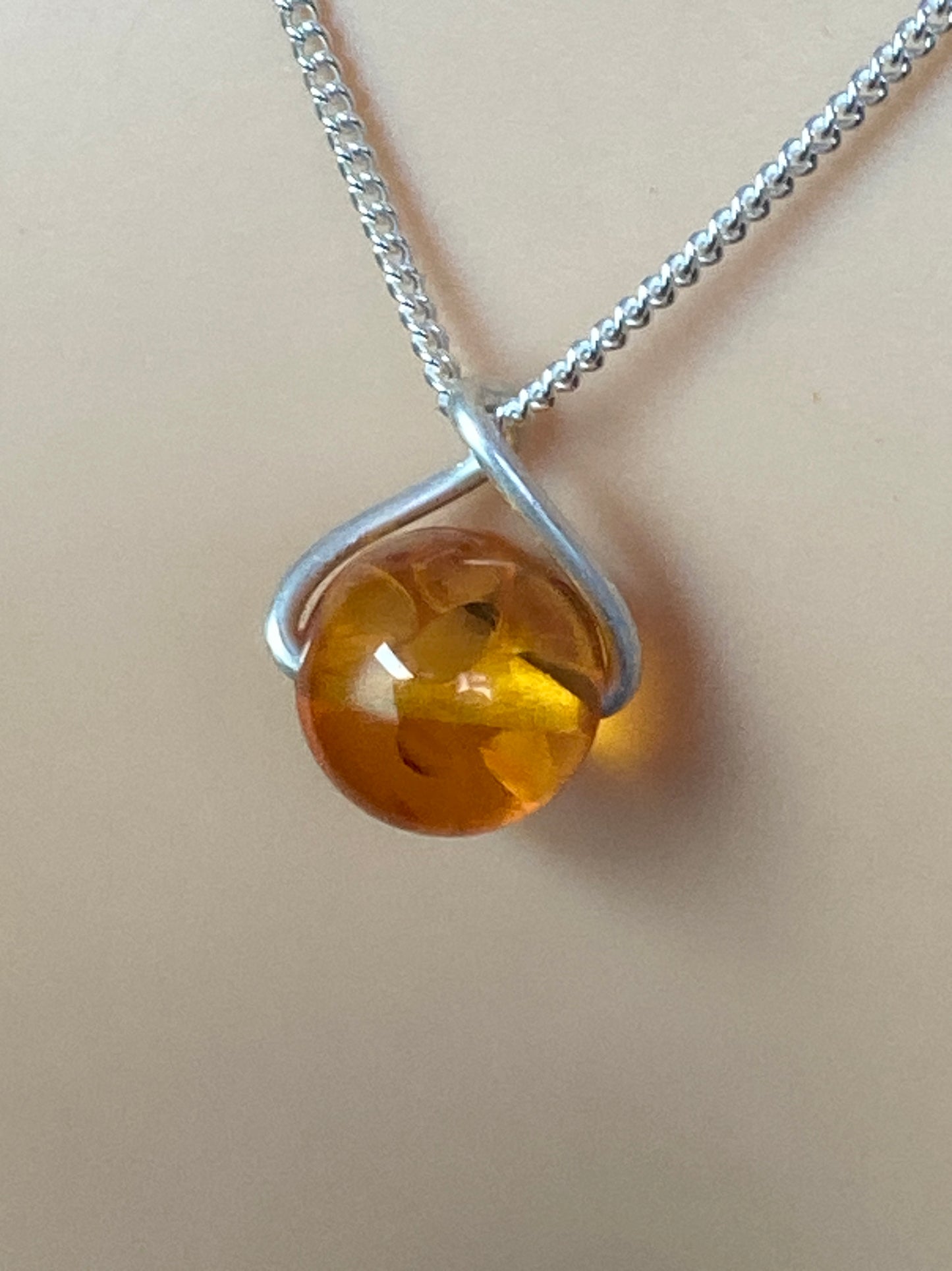 amber pendant, 18” sterling silver chain