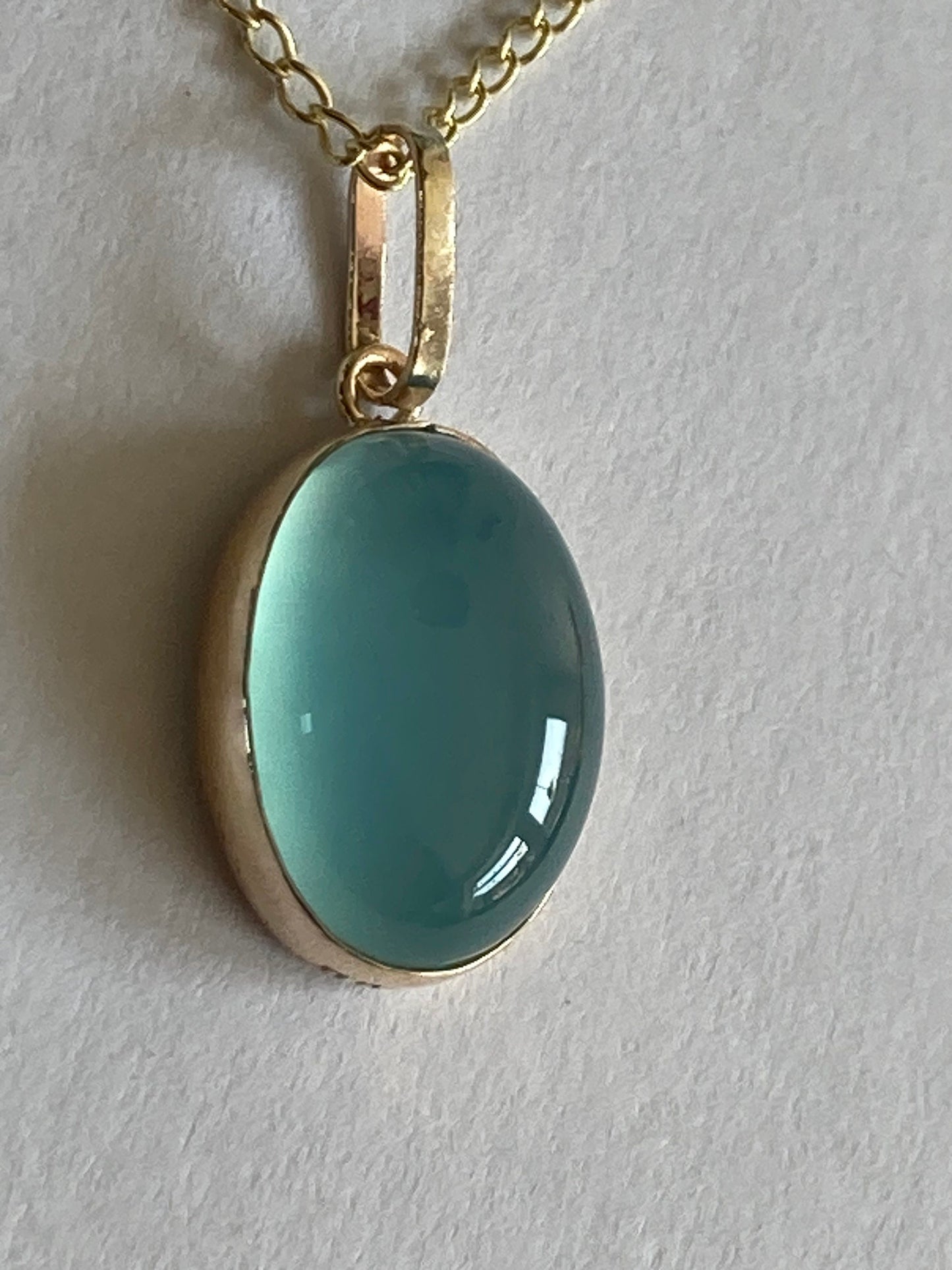 9ct gold blue pendant