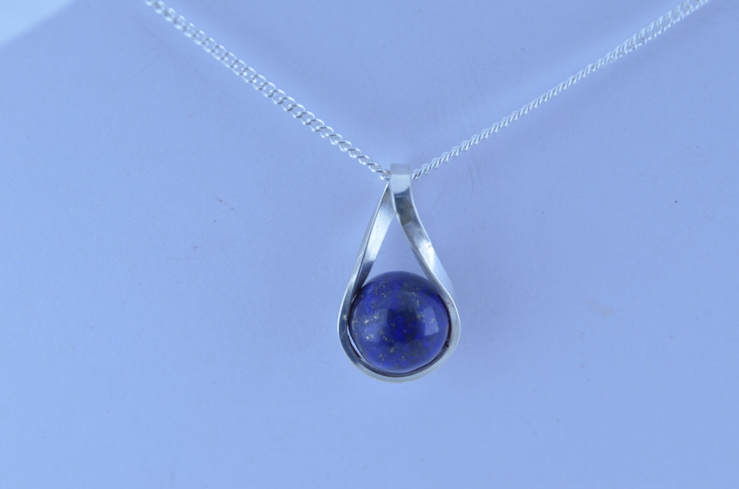 silver lapis lazuli necklace and 18” chain, natural bell shape blue gemstone, twist shaped design pendant