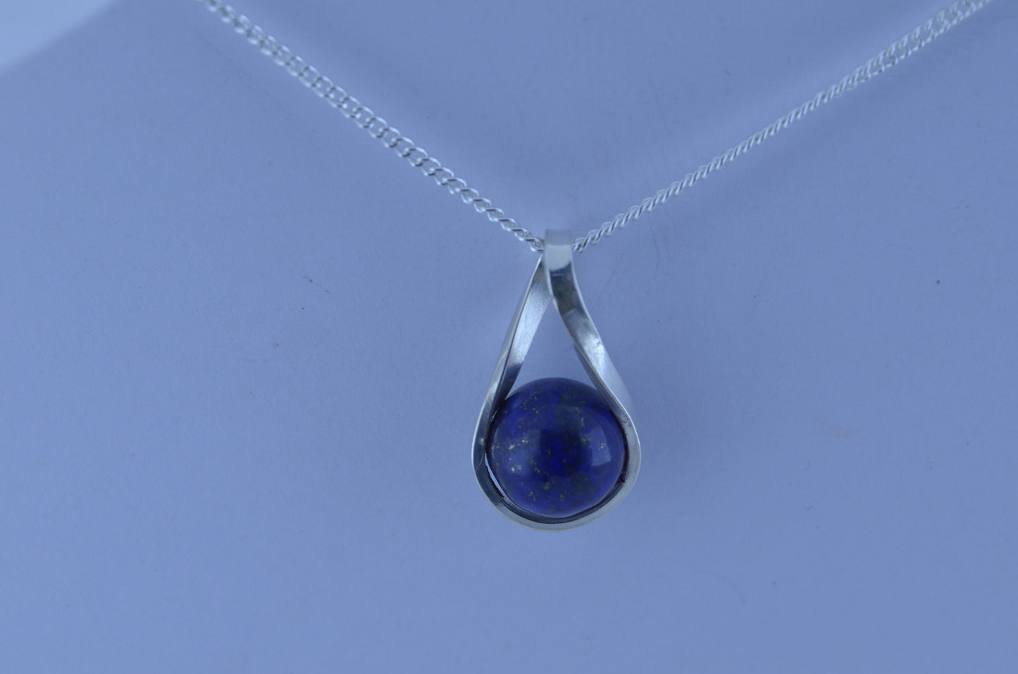 silver lapis lazuli necklace and 18” chain, natural bell shape blue gemstone, twist shaped design pendant