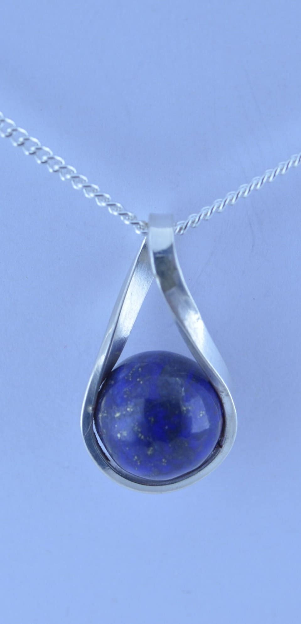 silver lapis lazuli necklace and 18” chain, natural bell shape blue gemstone, twist shaped design pendant