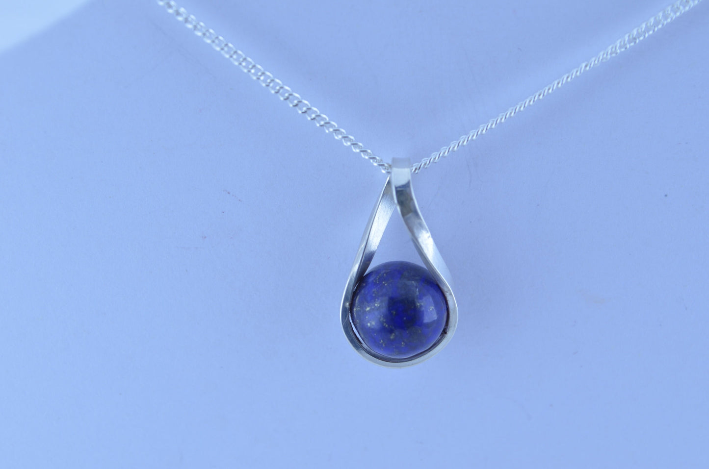 silver lapis lazuli necklace and 18” chain, natural bell shape blue gemstone, twist shaped design pendant