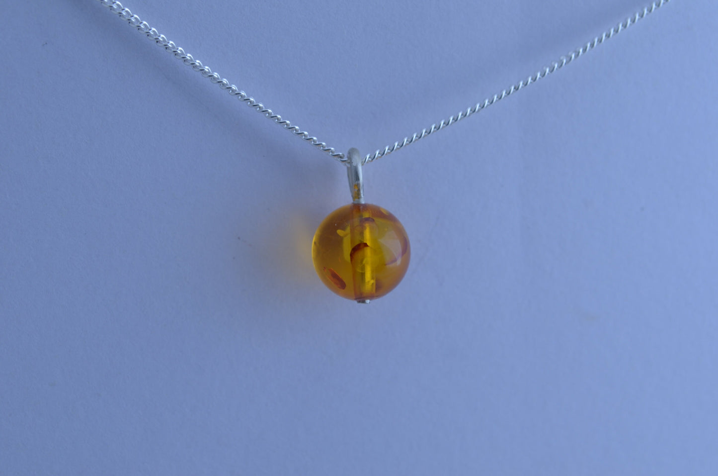 silver charm necklace, yellow amber pendant, round shape gemstone, 18” chain