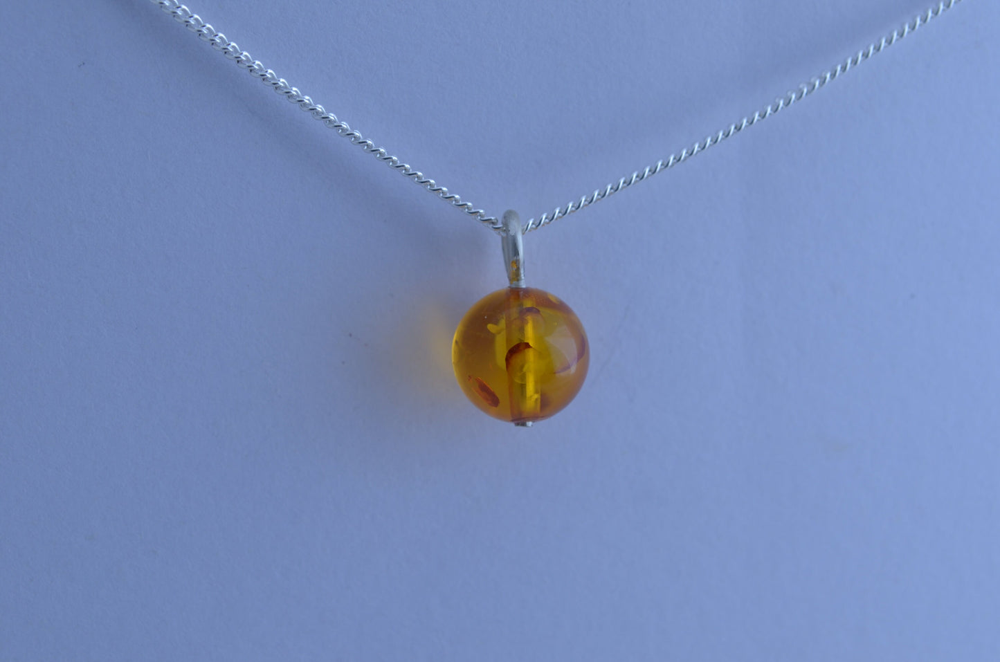 silver charm necklace, yellow amber pendant, round shape gemstone, 18” chain