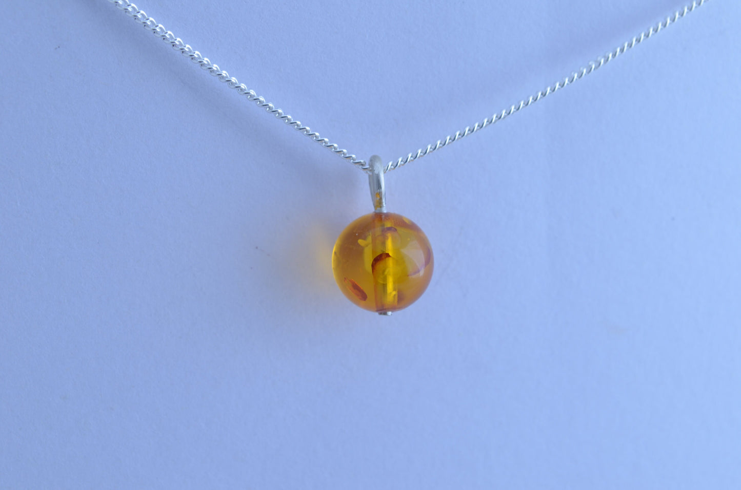 silver charm necklace, yellow amber pendant, round shape gemstone, 18” chain